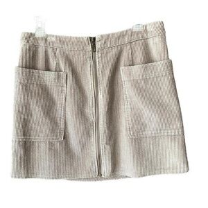 Corduroy front zipper beige mini skirt. Size large.